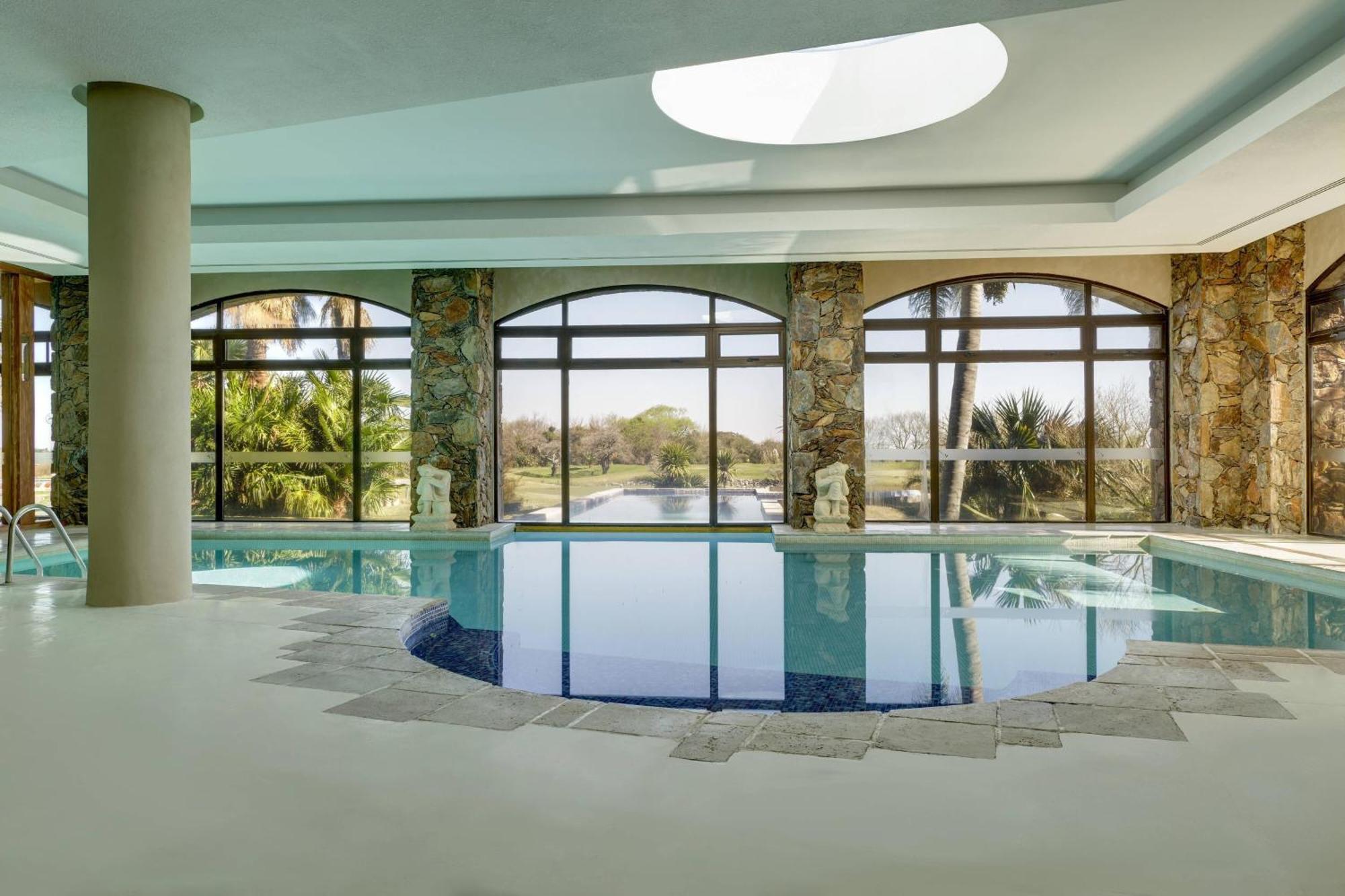 Sheraton Colonia Golf And Spa Resort Colonia del Sacramento Esterno foto The swimming pool at the hotel